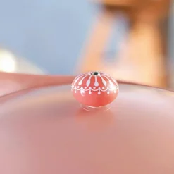 Poignée de cocotte rose